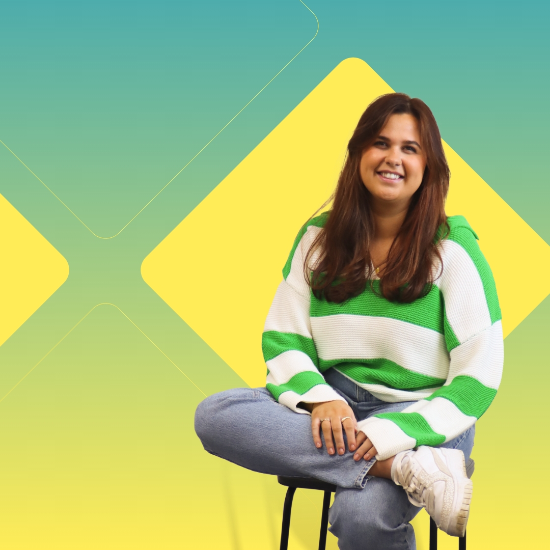 Bright graphic with a cut out of a woman sitting on a stool